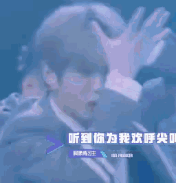 a man in a suit and tie is making a funny face with his hands up .
