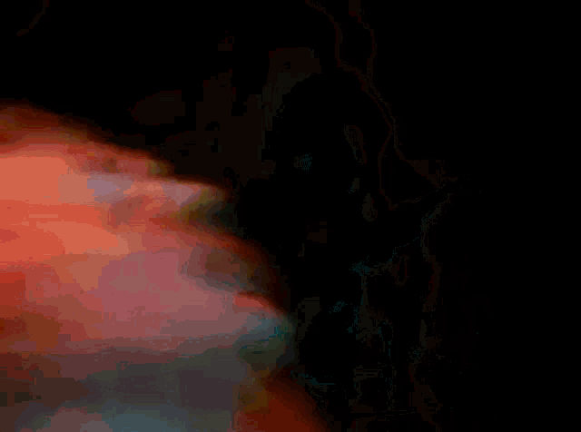a close up of a woman 's face with her eyes closed and her hair blowing in the wind .