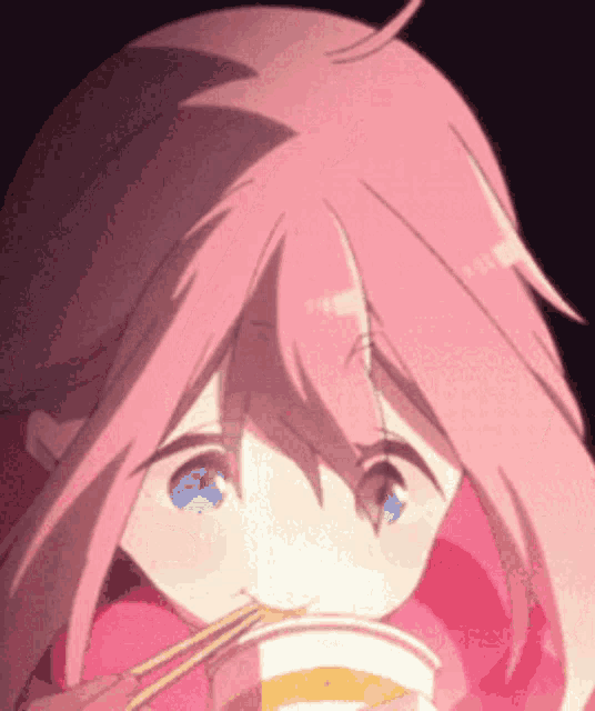 a girl with pink hair is drinking from a cup