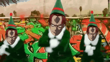 a group of elves are dancing in front of a graffiti wall .