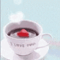 a cup of coffee with a heart in it and the words `` i love you '' written on it .