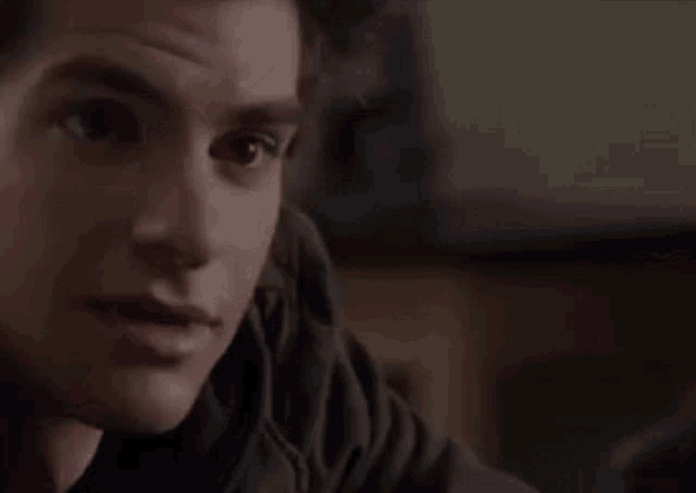 a close up of a man 's face looking at the camera .