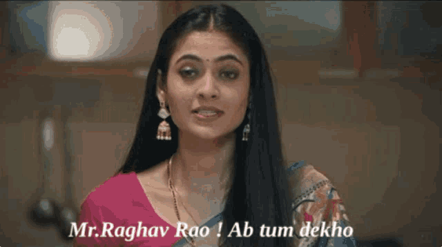 a woman in a pink and blue saree says mr. raghav rao ! ab tum dekho