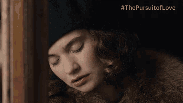 a close up of a woman 's face with #thepursuitoflove on the bottom