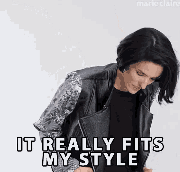 a woman wearing a black leather jacket says it really fits my style