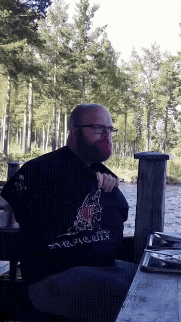a man with a beard wearing a shirt that says ' norwegian ' on the front