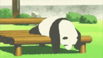 a panda bear is laying down on a wooden bench in a park .