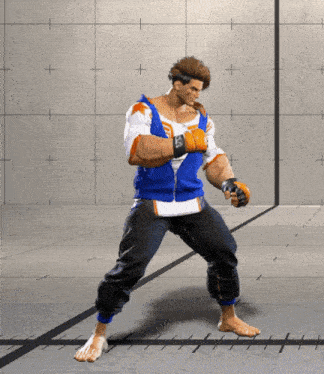 a man in a blue and white shirt and black pants is standing on a concrete floor