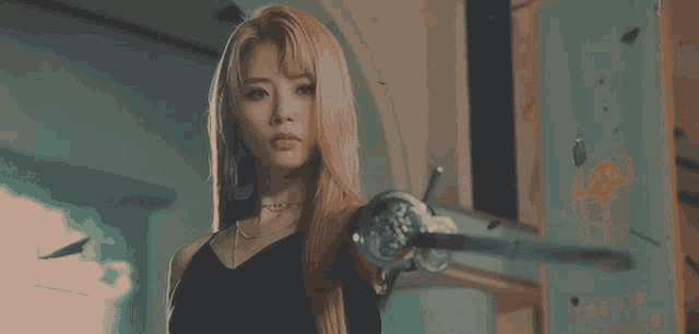 a woman holding a sword in front of a sign that says " dream "