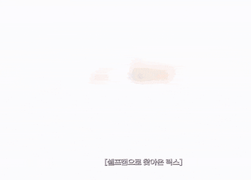 a close up of a person 's face with korean writing on it