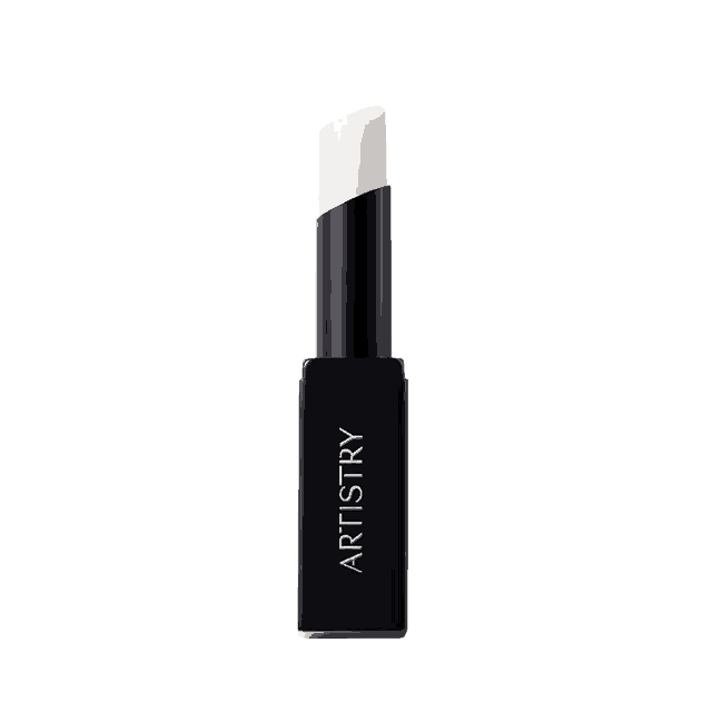 a black tube of artistry lip balm on a white surface