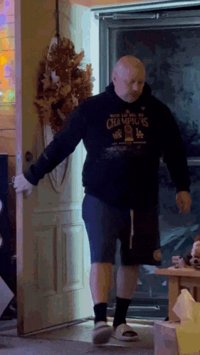 a man wearing a hoodie that says world champions