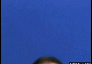 a man with his mouth open is making a funny face .