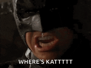 a close up of a person wearing a batman mask with their mouth open and the words `` where 's katttt '' .