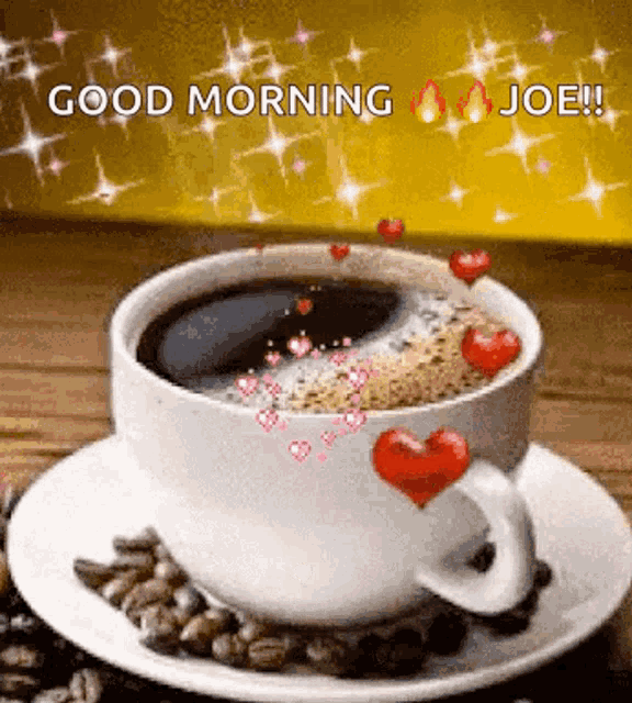 a cup of coffee on a saucer with hearts on it and the words good morning joe