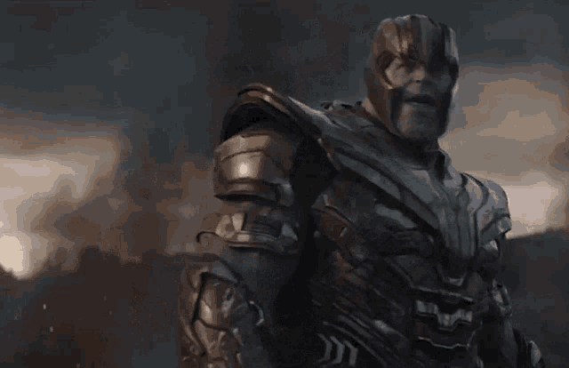 a close up of thanos from avengers endgame looking at the camera