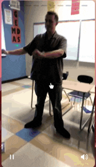 a man is standing in a classroom with the word gemd as on the wall