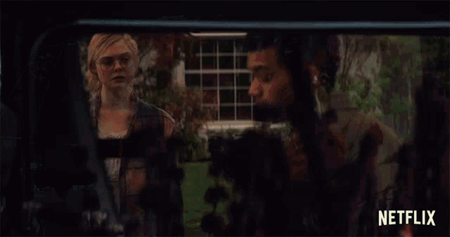 a netflix ad shows a woman and a man looking out of a car window
