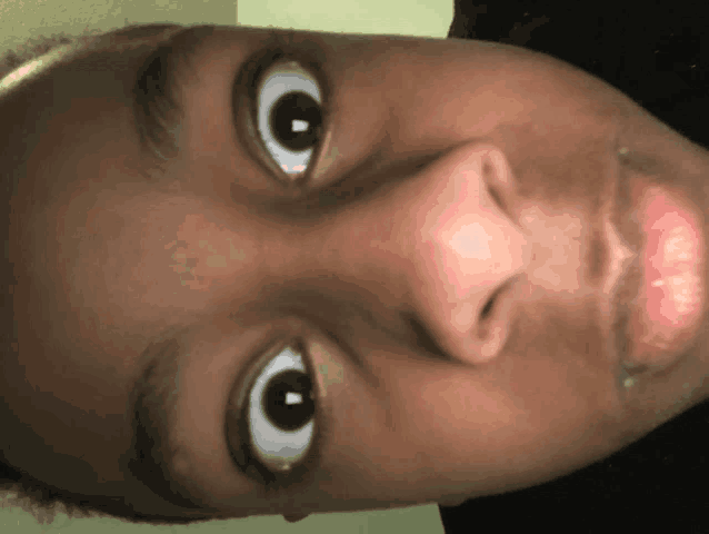 a close up of a person 's face with their eyes closed
