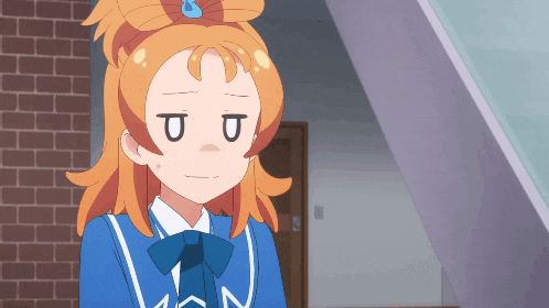 a girl with orange hair is wearing a blue jacket and a bow tie