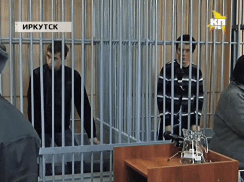 two men are in a jail cell with a sign that says irkytck