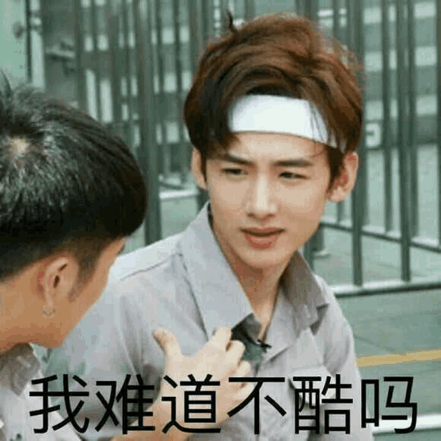a man wearing a headband is talking to another man in chinese .