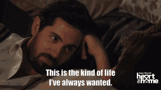 a man and a woman are laying on a couch and the man says this is the kind of life i ve always wanted