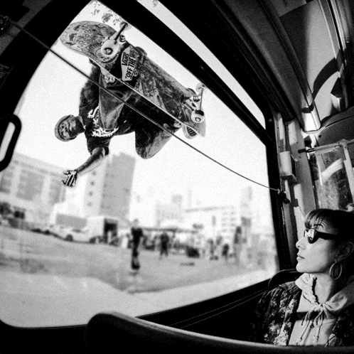 a skateboarder is doing a trick while wearing a shirt that says vans on the front