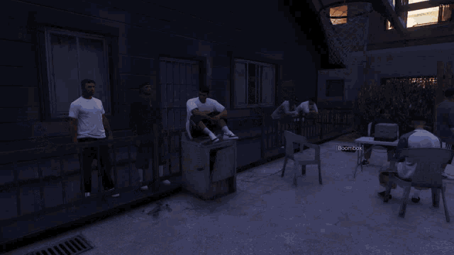 a screenshot of a video game shows a man sitting on a box with the word boombox on it