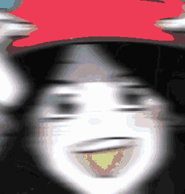 a blurry picture of a person wearing a hat