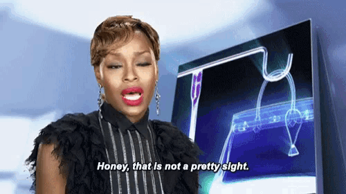 a woman is saying honey that is not a pretty sight in front of a computer screen .