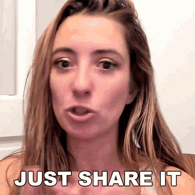 a woman says " just share it " in front of a mirror