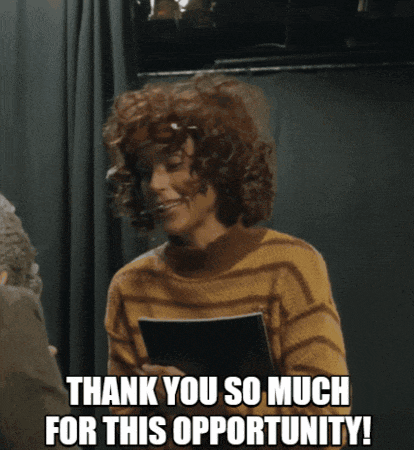 a woman with curly hair is holding a piece of paper and says thank you so much for this opportunity