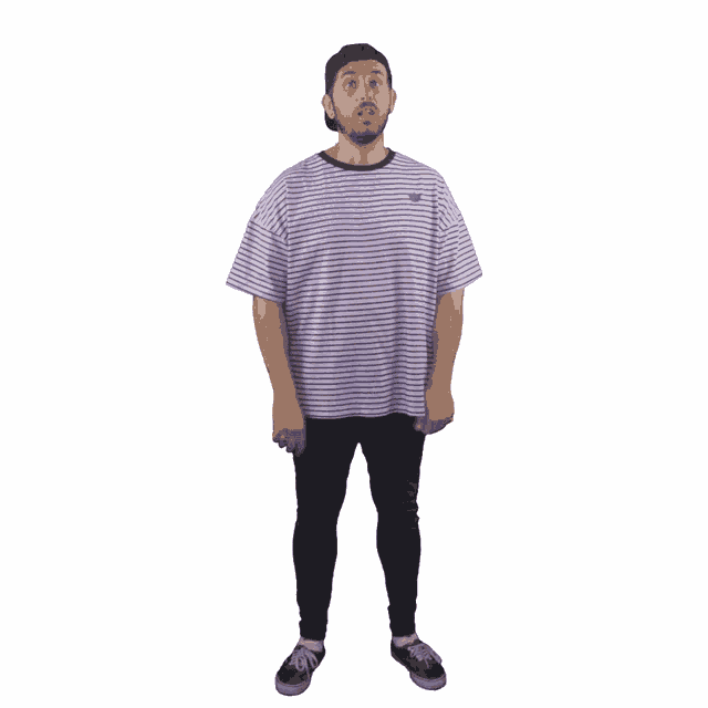 a man wearing a striped shirt and black pants is standing