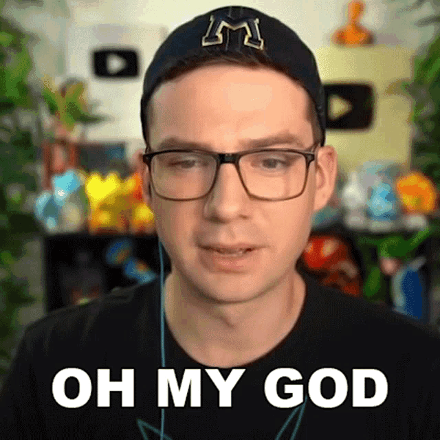 a man wearing glasses and a black hat says oh my god