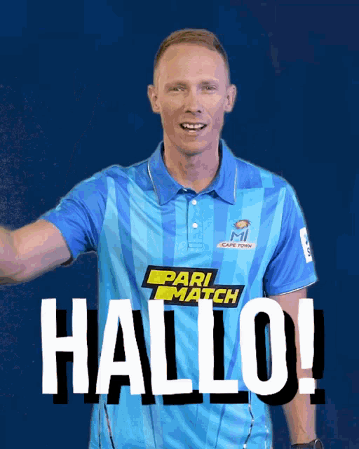 a man is wearing a blue shirt that says pari match