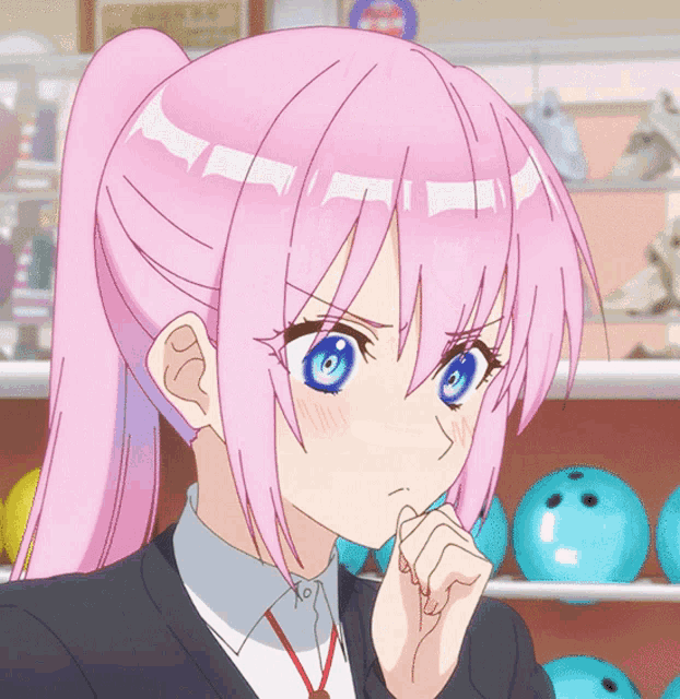 a girl with pink hair and blue eyes looks angry