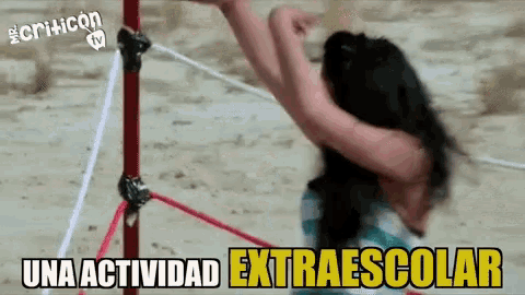 a woman is tied to a pole with the words una actividad extraescolar