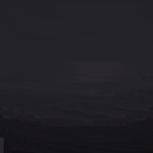 a dark background with a few bubbles of water coming out of it