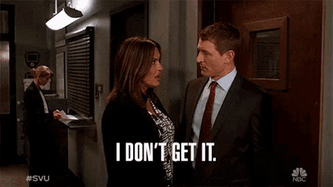 a man and a woman standing next to each other with i don 't get it written on the screen