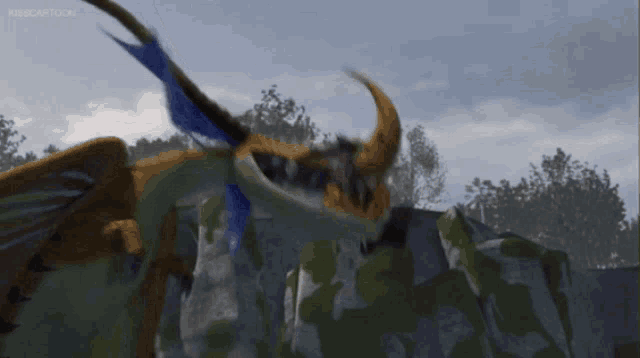 a dragon from how to train your dragon is flying over a mountain