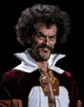 a man with a mustache and curly hair is wearing a red and white costume .