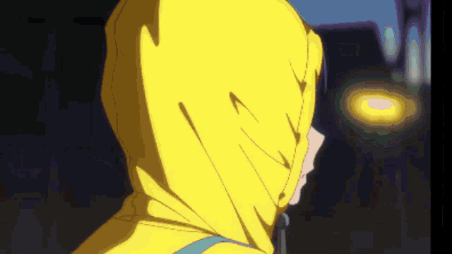 a person wearing a yellow hoodie with a blue strap