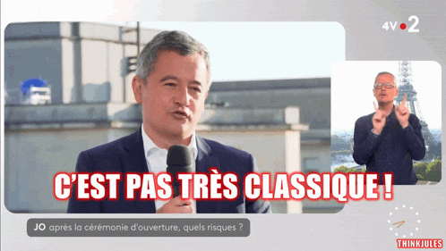 a man in a suit speaking into a microphone with the words " c'est pas tres classique " above him