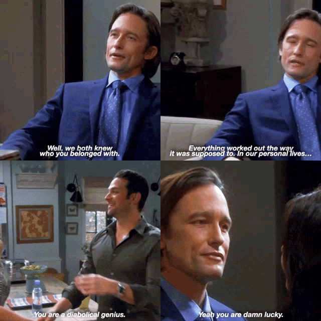 a man in a blue suit and tie is talking to another man