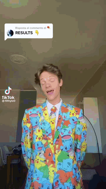 a man wearing a colorful suit with pokemon on it .