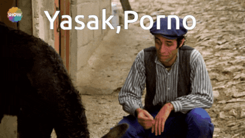 a man sitting next to a dog with the words yasak porno written on the bottom