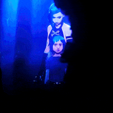 a girl with blue hair has a cross in her hair