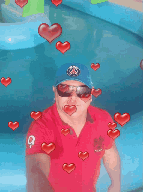 a man wearing sunglasses and a hat with the letter s on it is surrounded by hearts