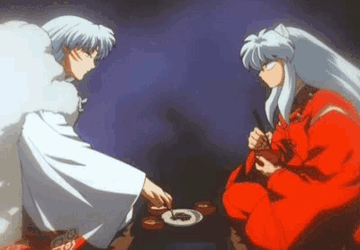 a couple of anime characters are sitting at a table and eating food .